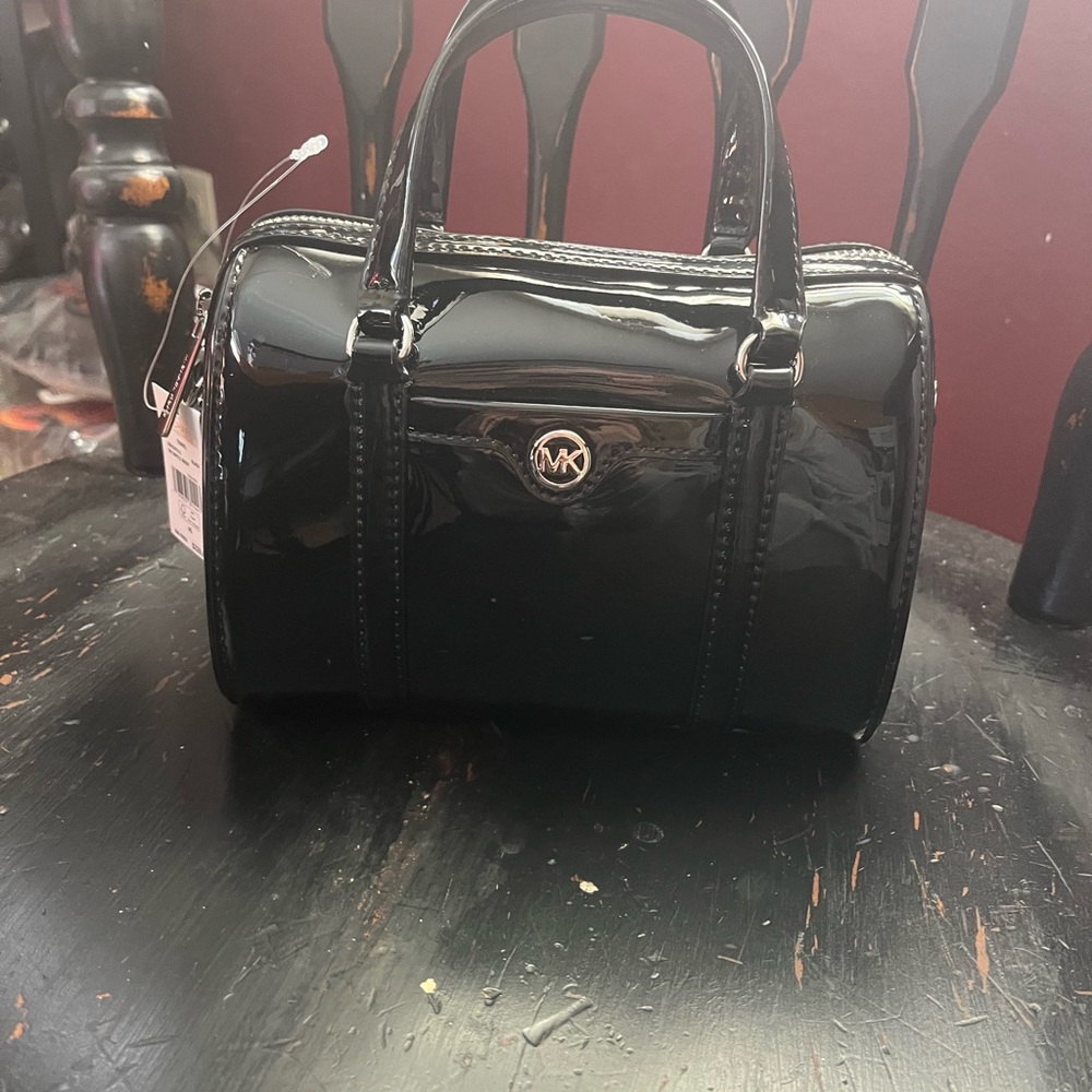 Not for sale. @Emily_mehalko 
Michael Kors Glossy Black Mini Boston Bag s